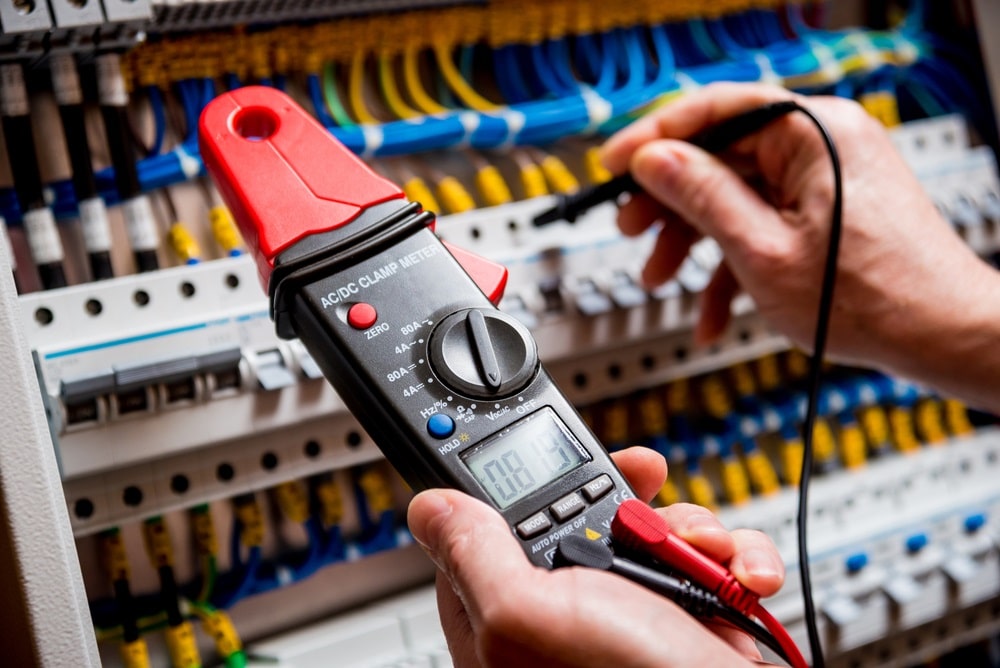 Electrical measurements with multimeter tester.