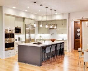 Kitchen Interior with Island, Sink, Cabinets, and Hardwood Floors