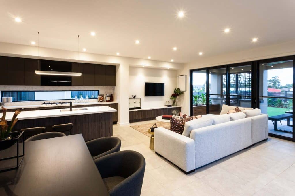 Modern living room and dining area beside patio area